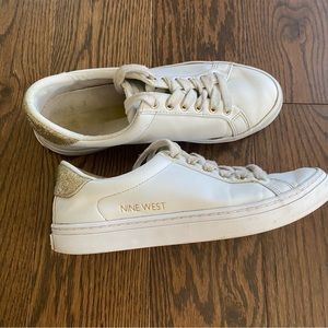 White and gold sneakers